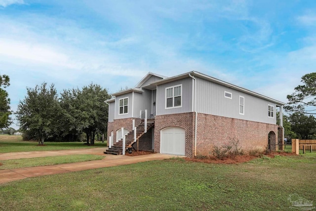 view of front of property with a front lawn and a garage