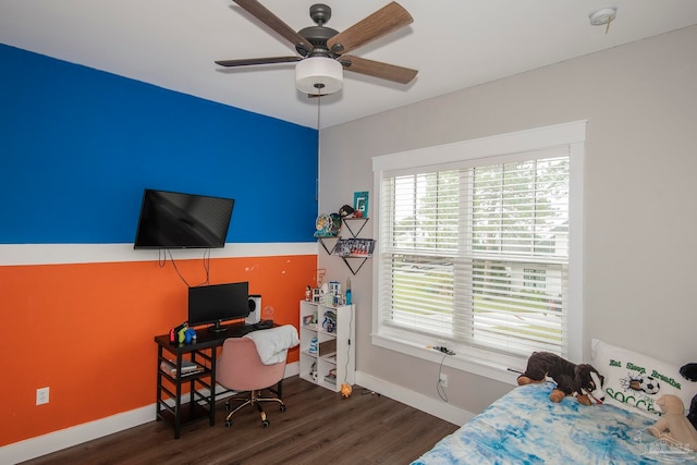 bedroom with dark hardwood / wood-style floors and ceiling fan