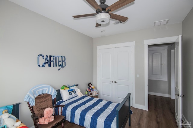 bedroom featuring a closet, ceiling fan, and dark wood-type flooring