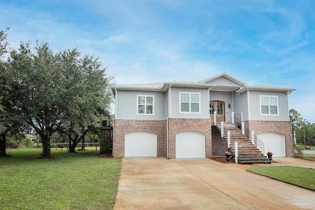 view of front of property with a garage and a front lawn