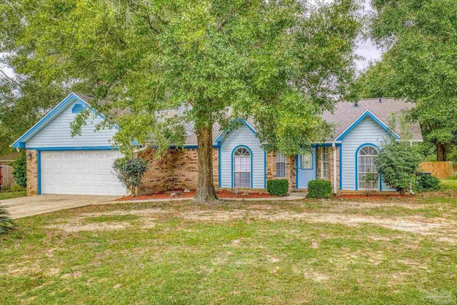 view of front facade featuring a front yard and a garage