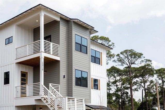 view of home's exterior with a balcony