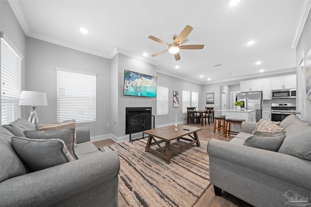 1121 W Romana St, Pensacola, FL 32502 - living room with a fireplace, light wood finished floors, recessed lighting, ceiling fan, and healthy amount of natural light