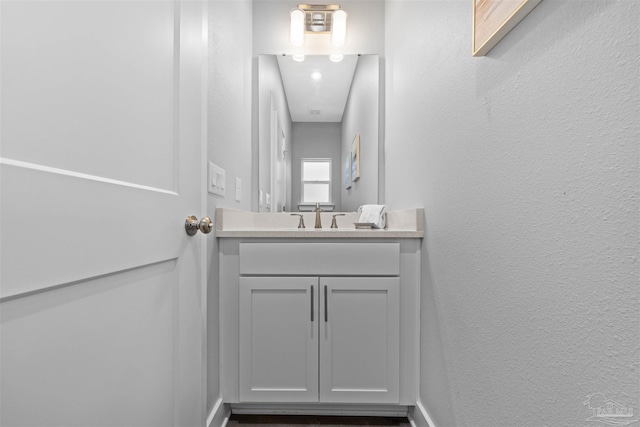 1121 W Romana St, Pensacola, FL 32502 - bathroom featuring a textured wall and vanity