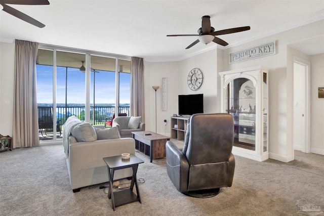 carpeted living room featuring a wall of windows, ornamental molding, ceiling fan, and a water view