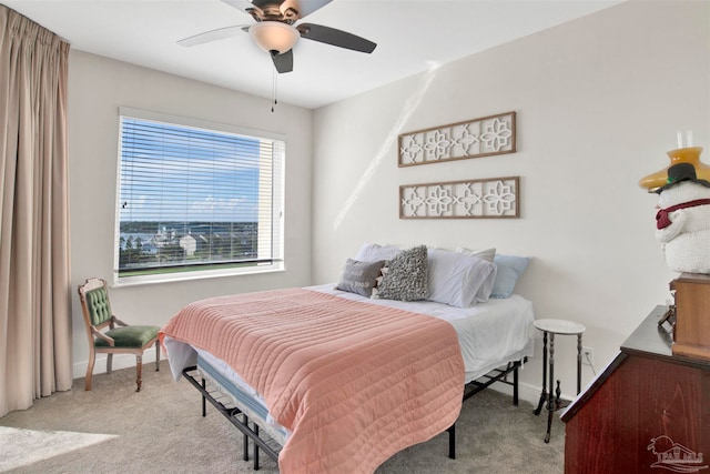 bedroom featuring light carpet and ceiling fan