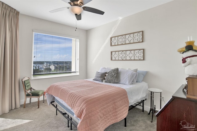 bedroom featuring light carpet and ceiling fan