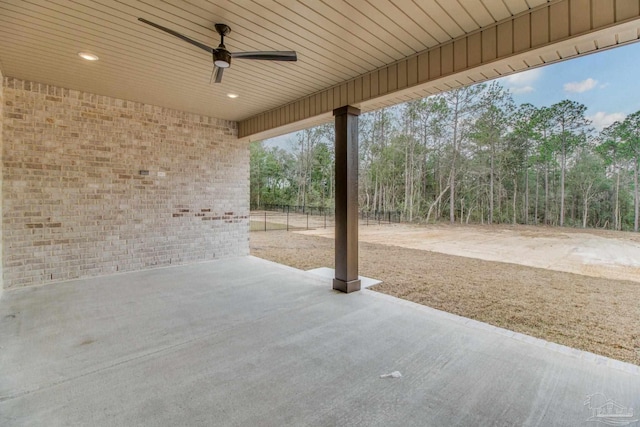 view of patio featuring fence and a ceiling fan