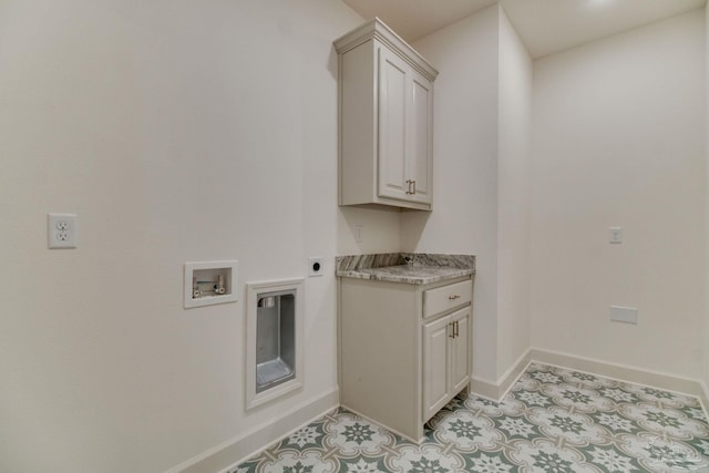 laundry room with cabinet space, hookup for a washing machine, baseboards, and electric dryer hookup