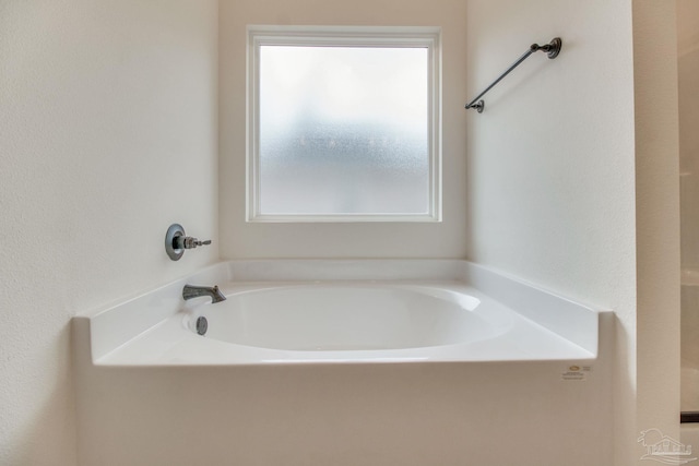 bathroom featuring a garden tub