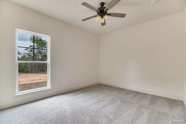 unfurnished room featuring ceiling fan, carpet floors, and baseboards