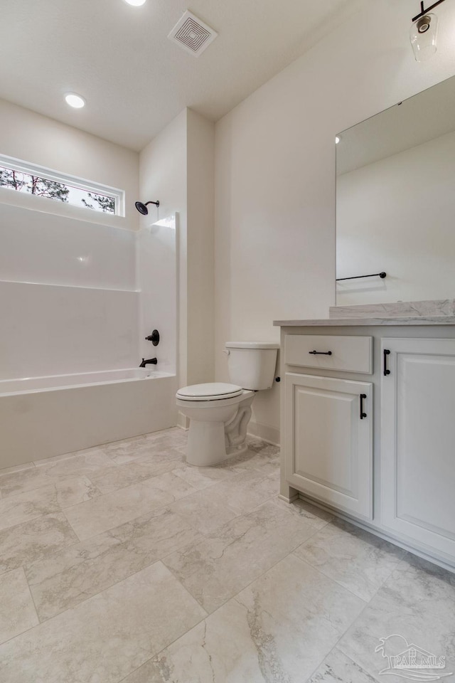 full bath with visible vents, toilet, marble finish floor, vanity, and shower / bathing tub combination