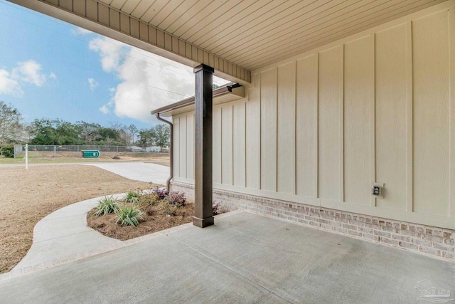 view of patio / terrace featuring fence