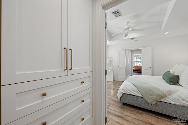 bedroom featuring light wood-style flooring, visible vents, and recessed lighting