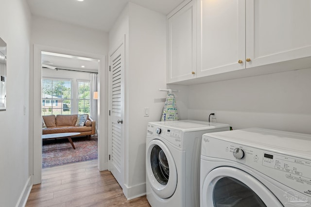 laundry room with recessed lighting, cabinet space, light wood-style floors, separate washer and dryer, and baseboards