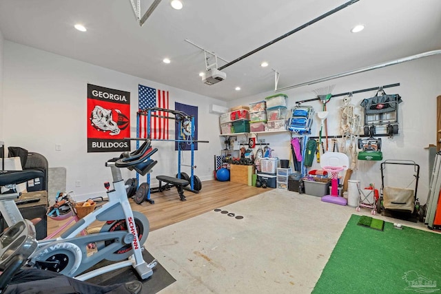 exercise room featuring a garage and recessed lighting