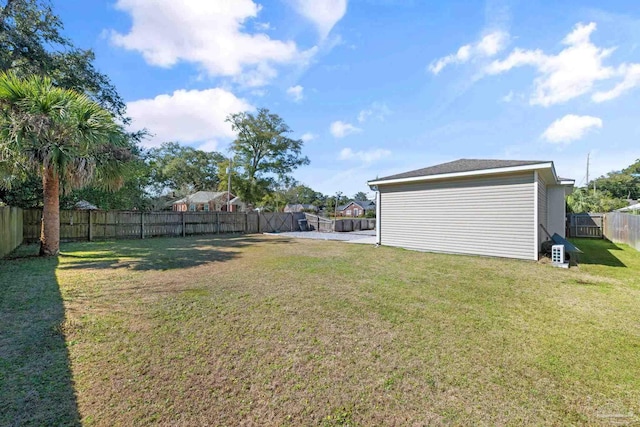 view of yard with a fenced backyard