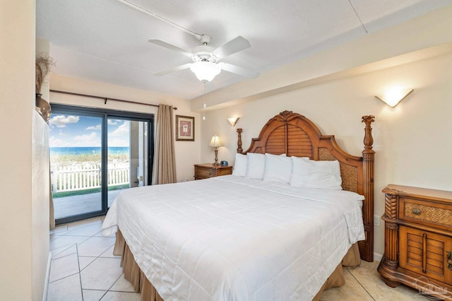 bedroom with light tile patterned flooring and access to exterior