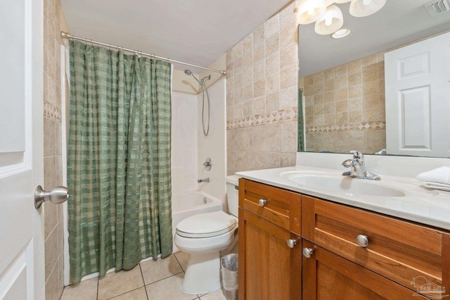 full bath with tile walls, visible vents, toilet, shower / bath combo, and tile patterned floors