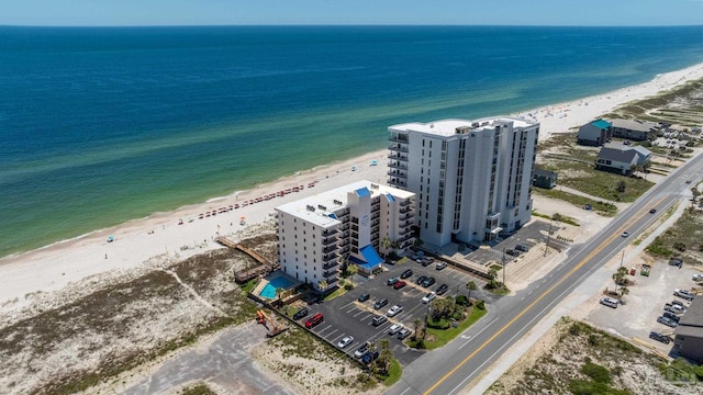 aerial view with a water view and a view of the beach