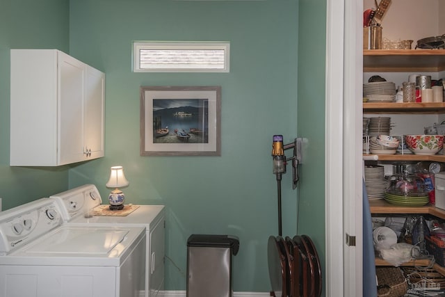 laundry room featuring independent washer and dryer and cabinet space