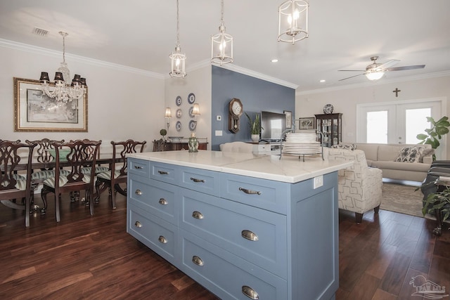 kitchen with a center island, open floor plan, and hanging light fixtures