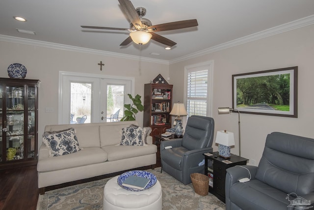 living area with visible vents, ceiling fan, dark wood-style flooring, crown molding, and recessed lighting