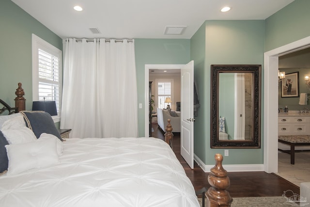 bedroom featuring recessed lighting, dark wood-style flooring, visible vents, and multiple windows