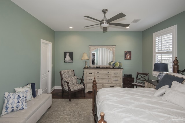 bedroom featuring recessed lighting, visible vents, a ceiling fan, wood finished floors, and baseboards