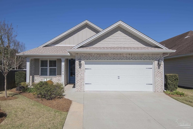 view of front of house with board and batten siding, brick siding, driveway, and an attached garage