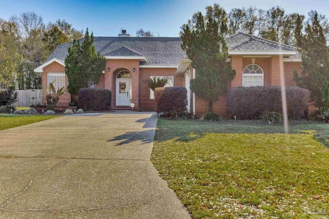 9348 Bell Ridge Dr, Pensacola, FL 32526 - single story home featuring brick siding, fence, a shingled roof, and a front yard