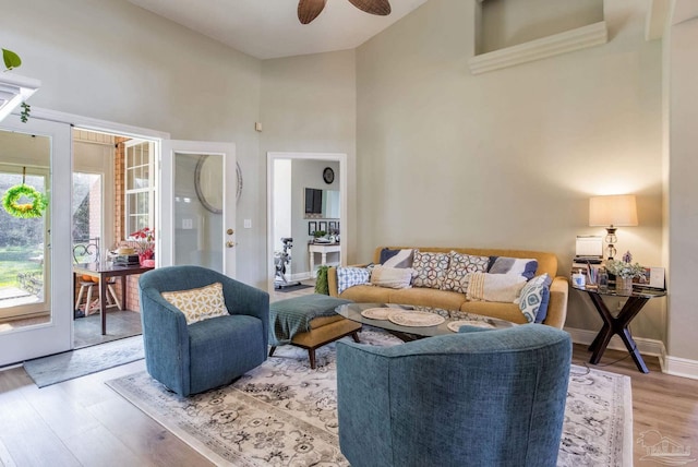 9348 Bell Ridge Dr, Pensacola, FL 32526 - living room featuring high vaulted ceiling, ceiling fan, baseboards, and wood finished floors