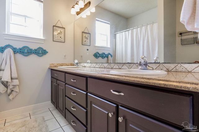 9348 Bell Ridge Dr, Pensacola, FL 32526 - full bath featuring a sink, tile patterned flooring, and double vanity