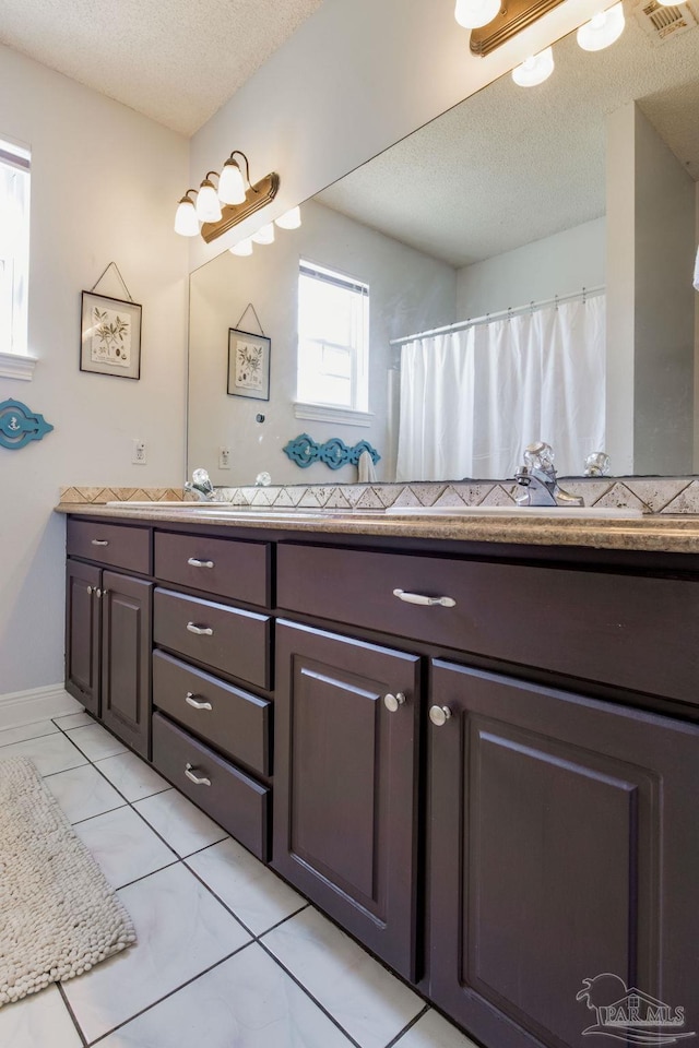 9348 Bell Ridge Dr, Pensacola, FL 32526 - full bathroom with vanity, a textured ceiling, and visible vents