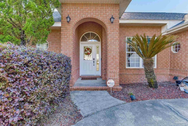 9348 Bell Ridge Dr, Pensacola, FL 32526 - doorway to property with brick siding and a shingled roof