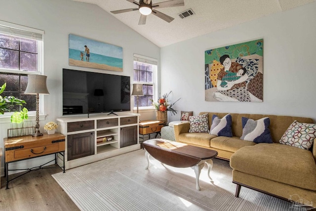 9348 Bell Ridge Dr, Pensacola, FL 32526 - living room with visible vents, a ceiling fan, wood finished floors, and vaulted ceiling