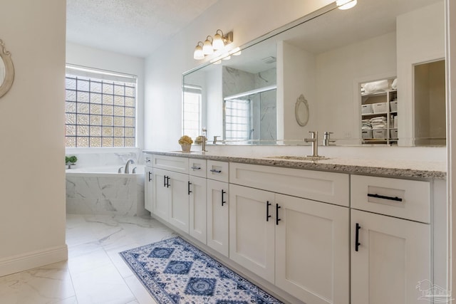 9348 Bell Ridge Dr, Pensacola, FL 32526 - bathroom featuring double vanity, a bath, a sink, marble finish floor, and a marble finish shower