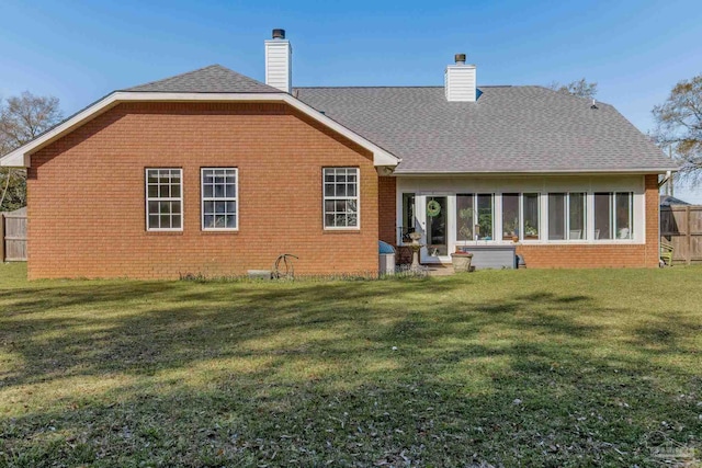9348 Bell Ridge Dr, Pensacola, FL 32526 - back of property featuring fence, a chimney, a yard, and brick siding