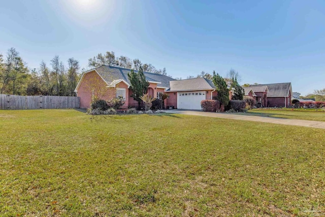 9348 Bell Ridge Dr, Pensacola, FL 32526 - ranch-style house with concrete driveway, fence, a front yard, and a garage