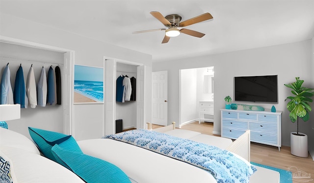 bedroom with a closet, connected bathroom, light hardwood / wood-style floors, and ceiling fan