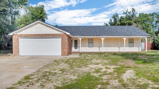 single story home with a porch and a garage