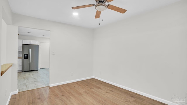 unfurnished room featuring ceiling fan and light hardwood / wood-style floors