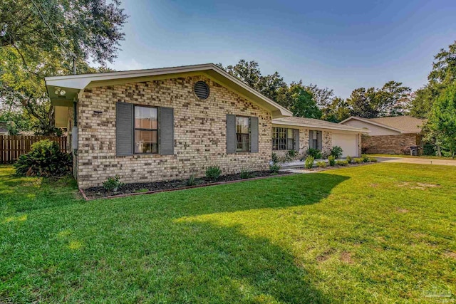 ranch-style home with a front yard and a garage