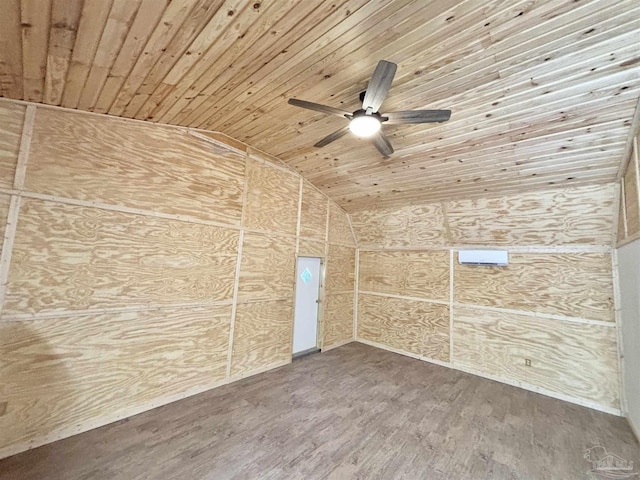 empty room with lofted ceiling, wood ceiling, a ceiling fan, and wood finished floors