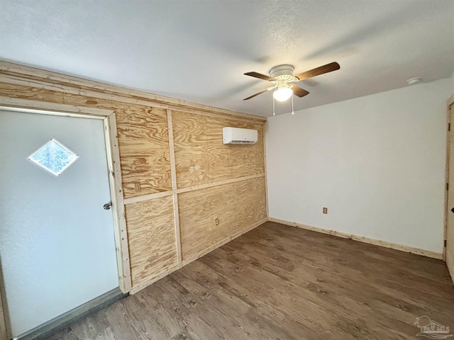 interior space with an AC wall unit and ceiling fan