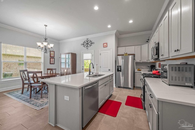 3209 Mountain Laurel Trl, Cantonment, FL 32533 - kitchen with stainless steel appliances, a sink, ornamental molding, light countertops, and a kitchen island with sink