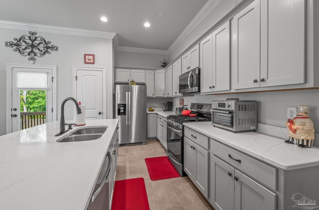 3209 Mountain Laurel Trl, Cantonment, FL 32533 - kitchen with stainless steel appliances, a sink, crown molding, recessed lighting, and light tile patterned flooring