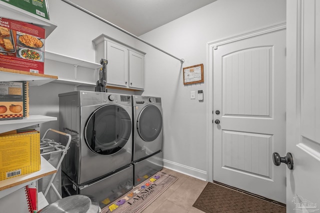 3209 Mountain Laurel Trl, Cantonment, FL 32533 - clothes washing area featuring independent washer and dryer, cabinet space, and light tile patterned floors
