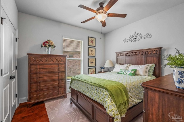 3209 Mountain Laurel Trl, Cantonment, FL 32533 - bedroom with dark wood-style flooring, a ceiling fan, and baseboards