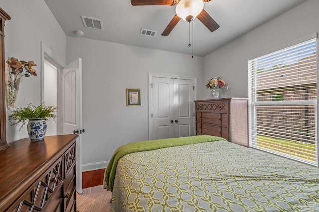 3209 Mountain Laurel Trl, Cantonment, FL 32533 - bedroom featuring a closet, baseboards, wood finished floors, and ceiling fan